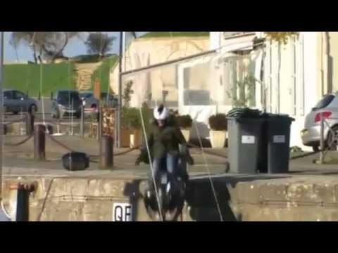 biker falls on a small pier