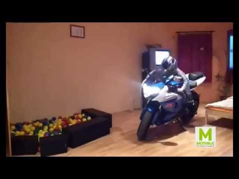 Girl dabbles with motorcycle
