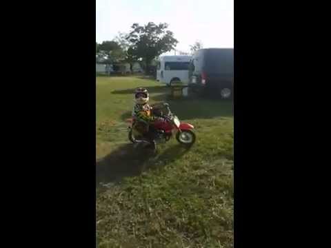 Little boy on a motorcycle stunt shows