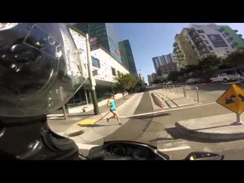 Motorcyclist Smashes Into Jogger At Intersection