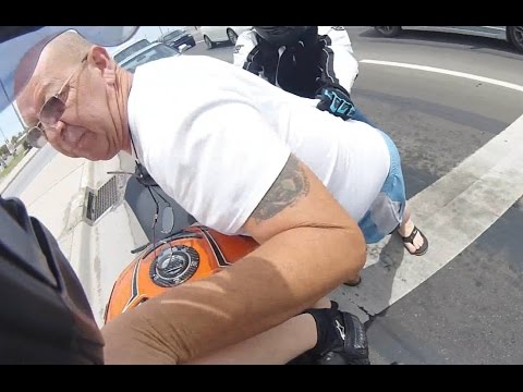 Road Rage Against Motoryclist Turns Physical